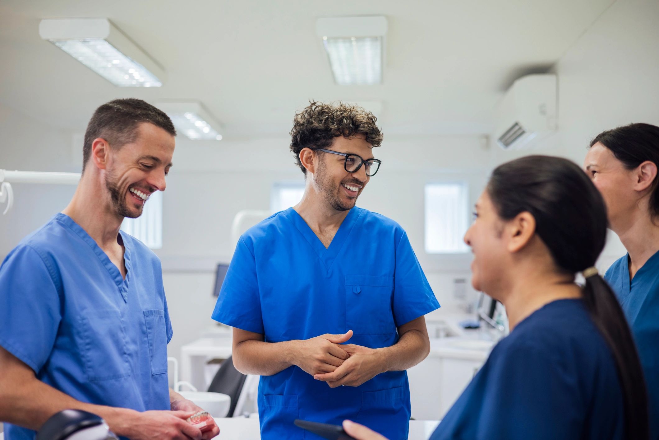 Healthcare professionals discussing operations in a clinical setting