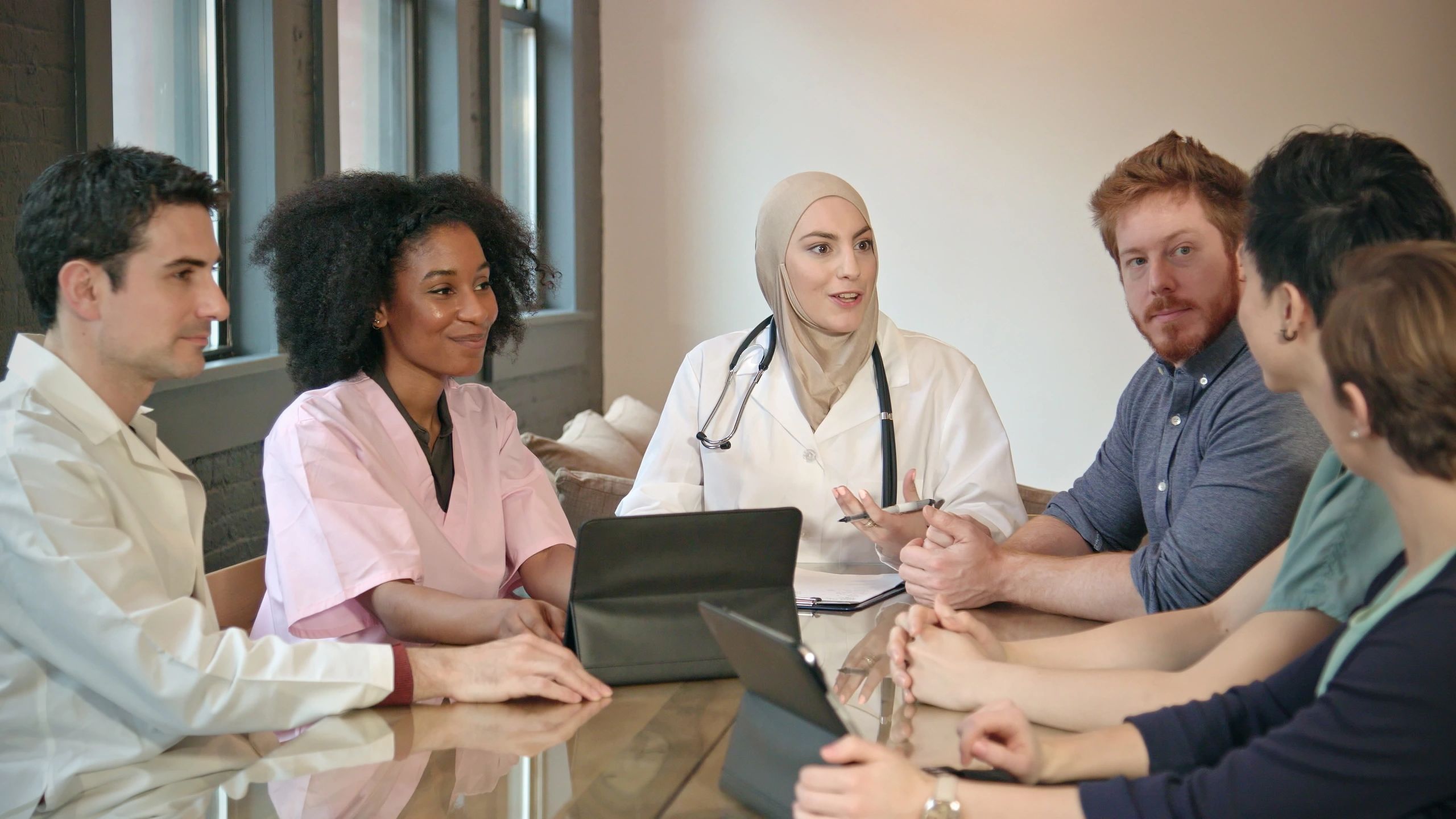 Healthcare team collaborating during an operational review